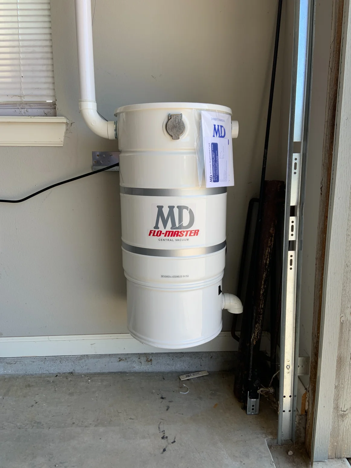 Installed Modern Day central vacuum power unit with piping in an Oklahoma home