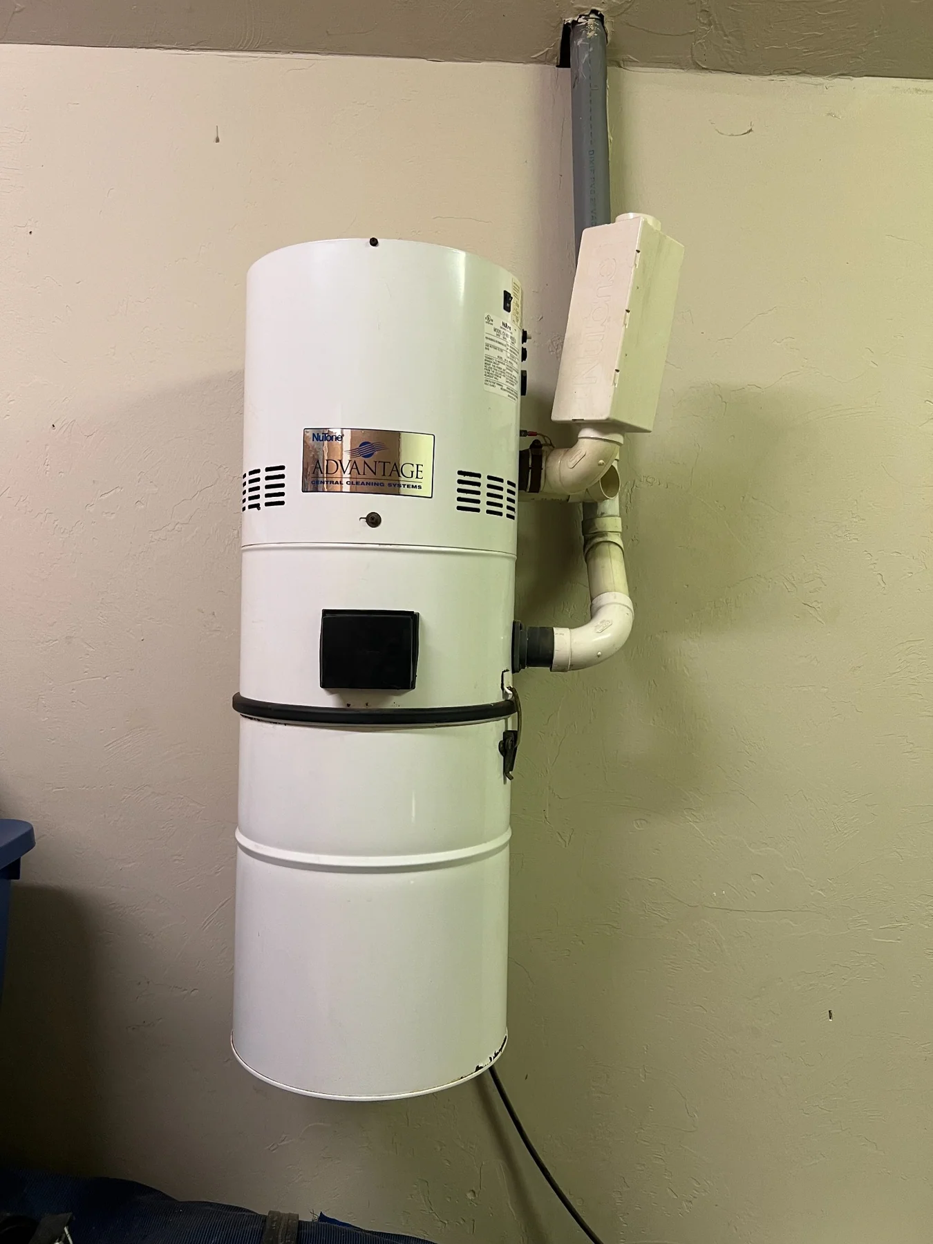 Older NuTone central vacuum power unit requiring service or possible upgrade